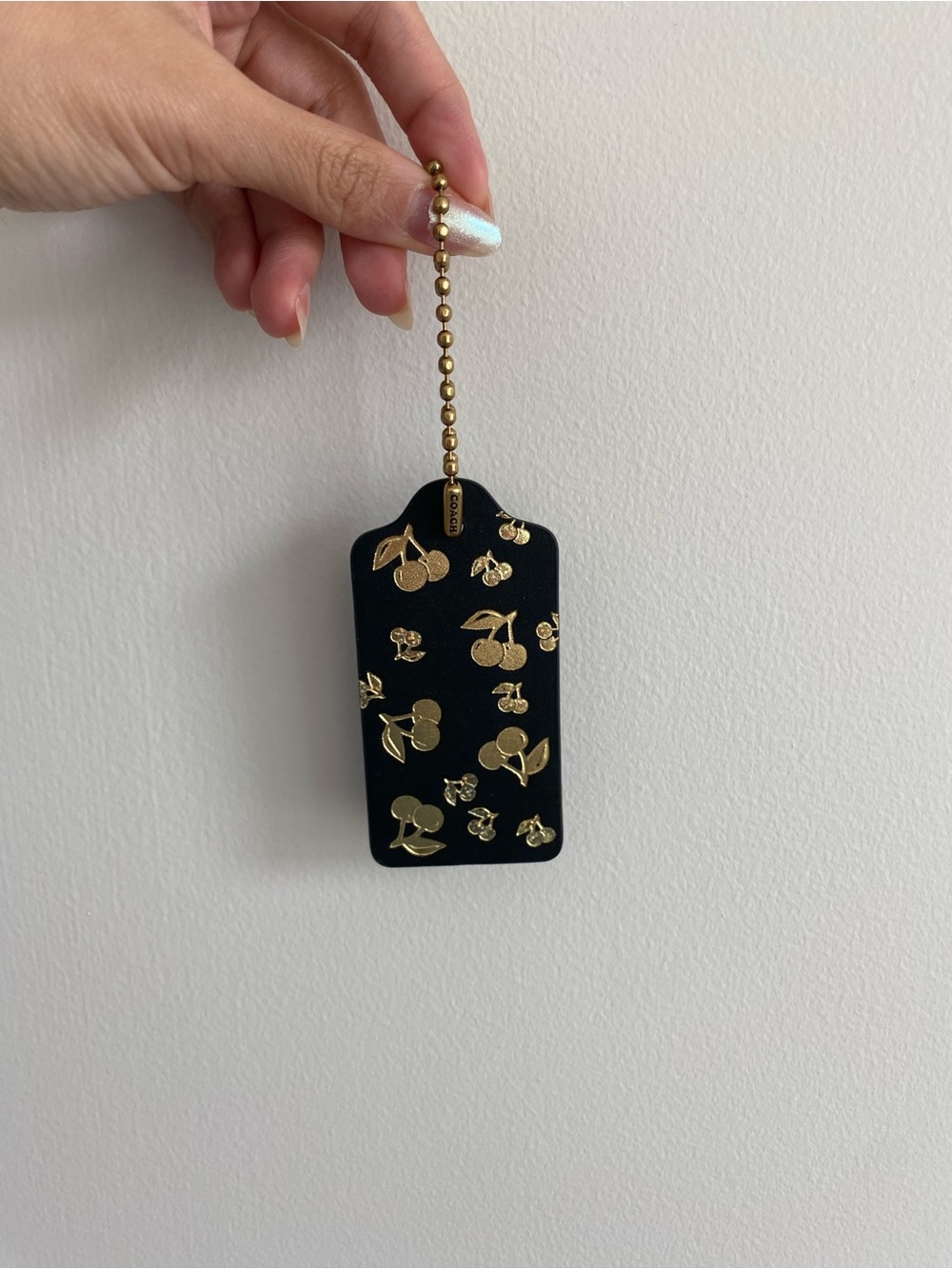 Coach Black Leather Cherry Hang Tag with Gold Hardware
